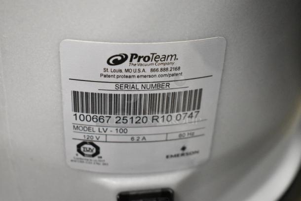 Brand new ProTeam LV-100 backpack vacuum label. Model and serial number visible. 120V, 1 phase, scratch and dent condition.