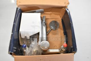 Brand new Waterloo 750FMS8 wall-mounted mop sink faucet, 8" centers, slight dents, original box, includes components.