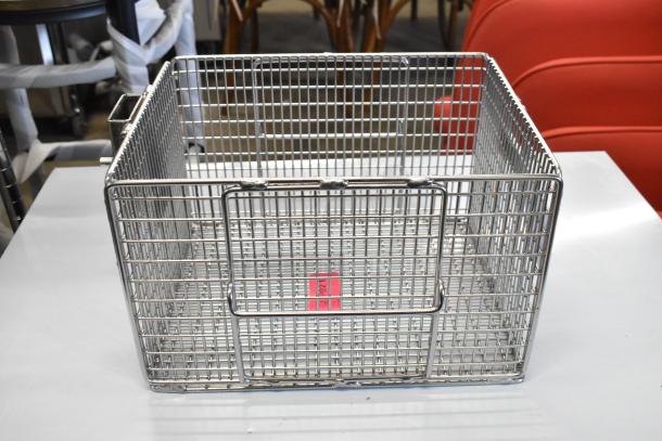 Brand new Henny Penny 186010 nugget fryer basket for 600 gas fryer, metal construction, minor scratches visible.