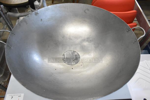 Brand new 30" Town 34730 hand-hammered Cantonese wok, showing minor scratches and dents. Great for high-volume cooking.