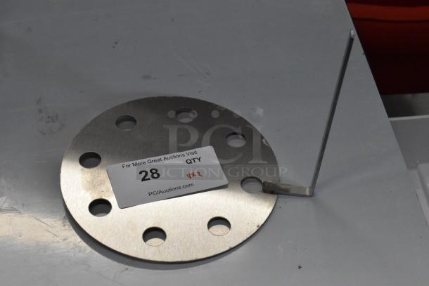Stainless steel skimmer plate with holes, labeled "28" for auction; new with scratch and dent condition.