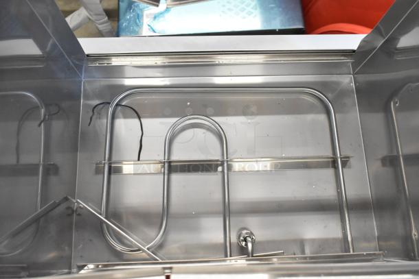 Avantco 177HDS100 stainless steel hot dog steamer interior, showcasing new condition heating elements.