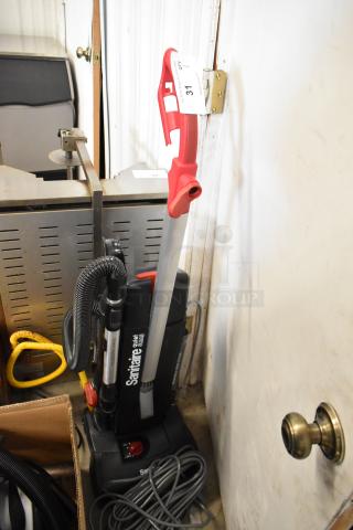 BRAND NEW Sanitaire SC9180D multi-surface upright vacuum cleaner, 13-inch, 120V, bagged, visible minor scratches.