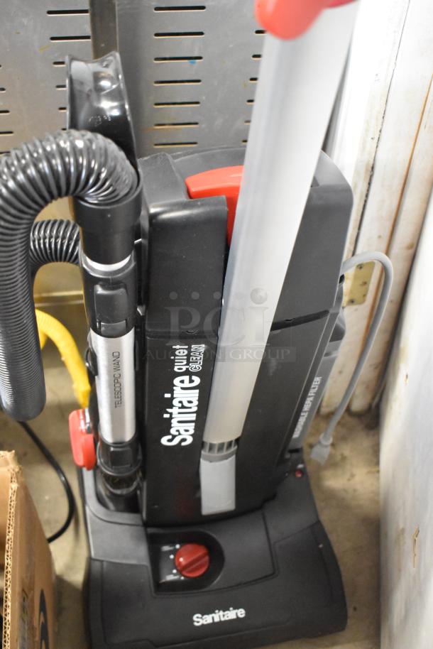BRAND NEW Sanitaire SC9180D QuietClean upright vacuum, multi-surface, 13" wide, 120V, scratch and dent condition.