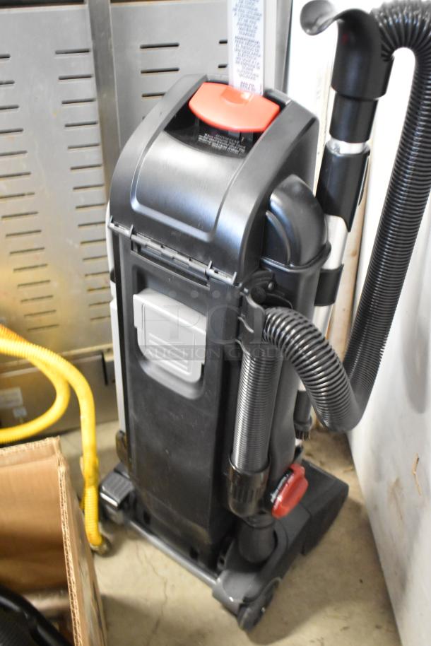 Sanitaire SC9180D upright vacuum, scratch and dent condition, 13" multi-surface bagged, 120V, with visible hose.