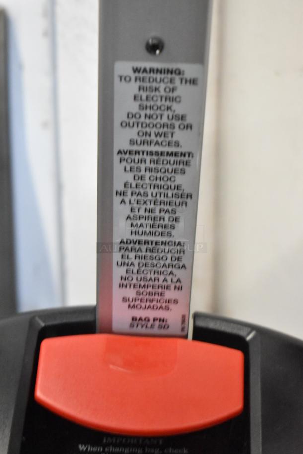 Sanitaire SC9180D Upright Vacuum, 13" Multi-Surface, Scratch and Dent, New. Warning label advises indoor dry use.