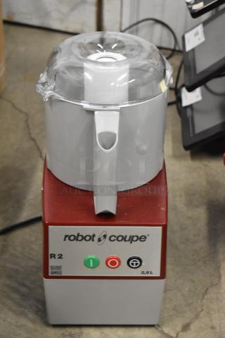 Brand new Robot Coupe R2 food processor with 3 qt gray bowl, continuous feed, 3 blades; minor scratches, 120V, 1 phase.