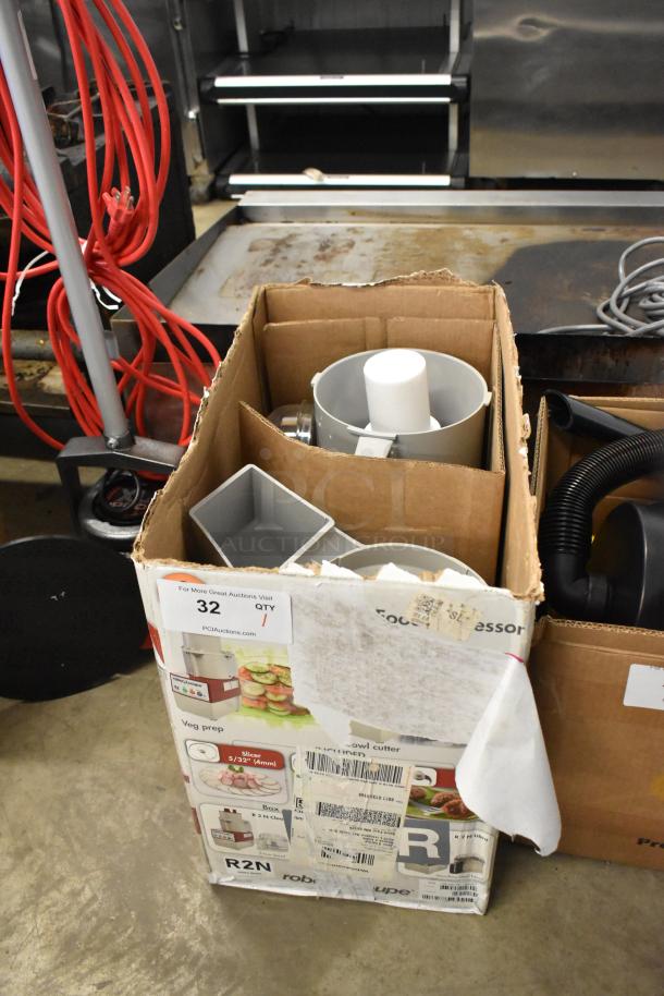 Brand new Robot Coupe R2 food processor in box, 3 Qt. gray bowl, 3 blades, continuous feed, 120V, scratch and dent condition.