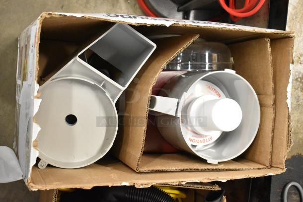 Brand new Robot Coupe R2 food processor in box, 3 Qt gray bowl, continuous feed, 3 blades, 120V, shows minor box wear.
