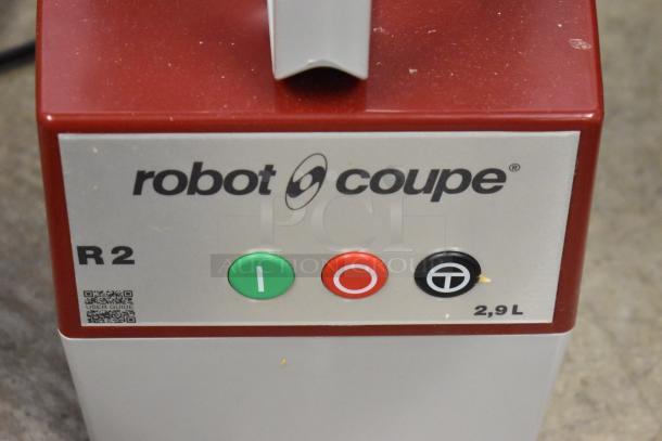 BRAND NEW Robot Coupe R2 food processor, gray bowl, continuous feed, 3 blades, 120V, minor scratches, control panel view.