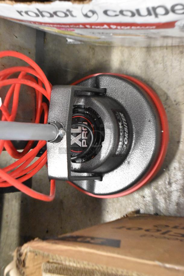 Brand new Oreck 550MC Orbiter 12" floor machine, 115V, minor scratches and dents, visible "Oreck Orbiter" label.
