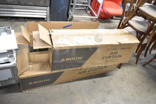 Three Boltic air curtains in boxes, models 6871509BPC, 6873512LYB, 6871510BPC; new, mixed condition, black powder coat.