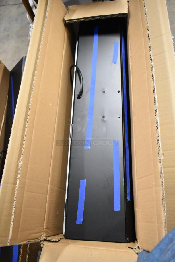 New Boltic 36" black powder coat air curtain in box with plunger door switch.