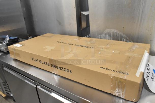 Brand new Avantco SNZGD8 49" flat glass sneeze guard in box, marked "Flat Glass 360SNZGD8" and "Made in China."