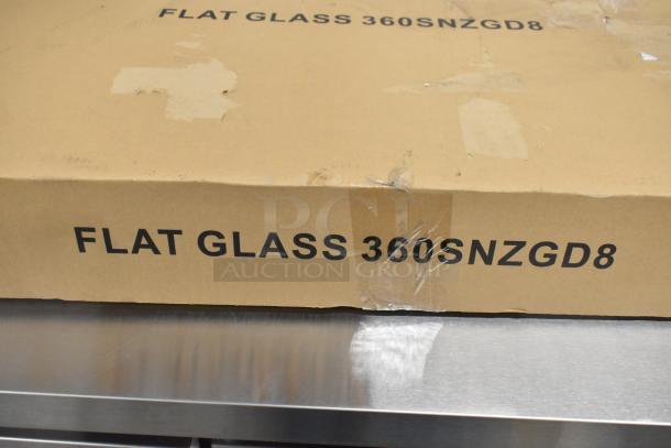 Brand new Avantco SNZGD8 Flat Glass Sneeze Guard, 49", in original packaging with minor scratches and dents visible.