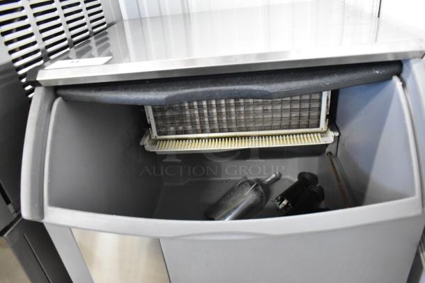 2022 Ice O Matic ICEU150FW8 commercial ice machine, metal exterior, self-contained, 115V, 1 phase, interior view.