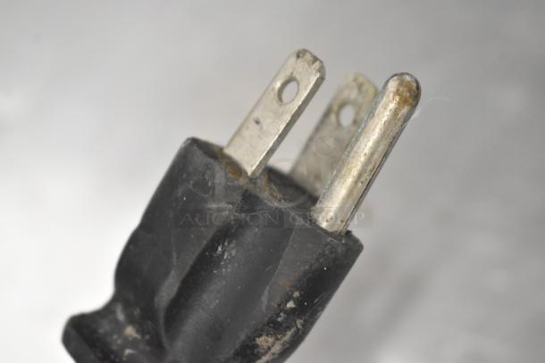 Close-up of a plug from a Hatco GR2SDH-24D commercial heated display shelf, showing wear and condition details.