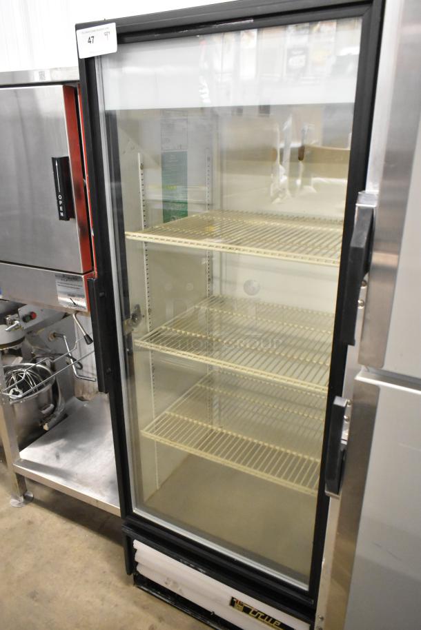 True GDM-12 commercial single door reach-in cooler, metal frame, 115V, 1 phase, good condition, multiple shelves.