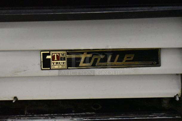 True GDM-12 commercial cooler, single door, metal, 115V, 1 phase, "True" logo, good condition.
