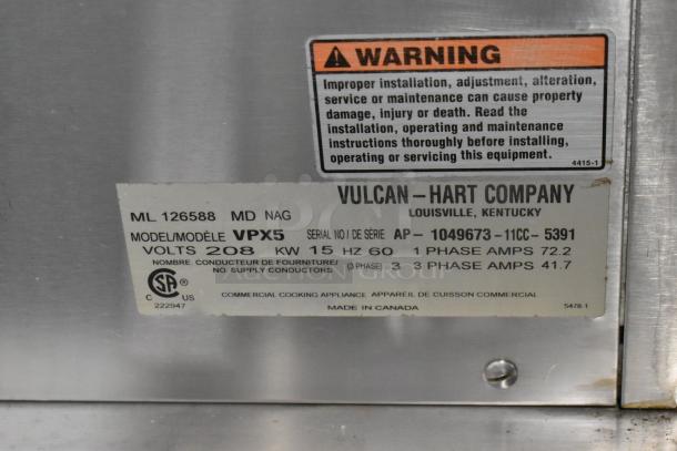 Vulcan VPX5 Steam Cabinet label showing model, voltage, and safety warning. Made in Canada, 208 volts.