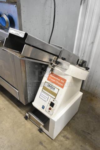 Oliver 702-N Metal Commercial Bagel Slicer, 115V, 1 Phase, countertop model. Features branding and operational labels.