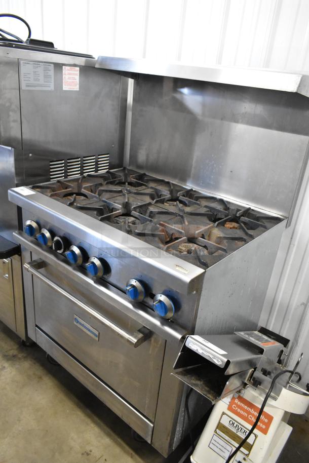 Standard Range SR-R36 stainless steel commercial gas range with 6 burners, oven, over shelf, backsplash, on casters.