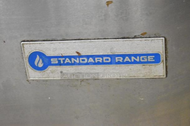 Standard Range SR-R36 stainless steel commercial 6-burner range with oven, overshelf, backsplash, on casters.