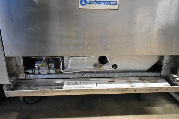 Stainless steel Standard Range SR-R36 commercial 6 burner range with oven, over shelf, back splash, and casters shown.