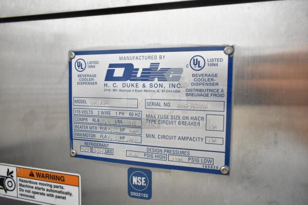 Electro Freeze 876-214 stainless steel frozen beverage machine, single flavor, on commercial casters. Visible technical specs: 115 volts, 1 phase.