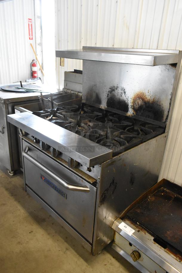 Bakers Pride stainless steel commercial gas range with 6 burners, oven, over shelf, and backsplash. Used condition.