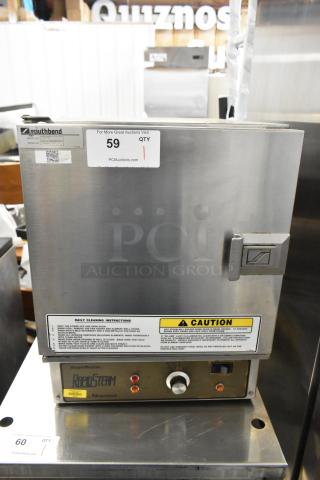 Southbend RS-4E RapidSteam stainless steel commercial countertop steam cabinet, single deck, model RS-4E, caution label visible.