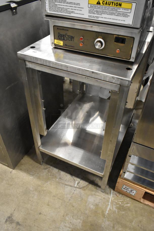 Stainless steel equipment stand with sturdy under shelf, ideal for kitchen equipment storage. Used condition, clean surface.