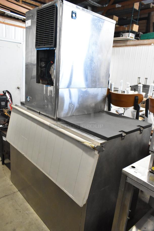 Hoshizaki stainless steel commercial ice head on bin, features large capacity, visible wear, suitable for industrial use.