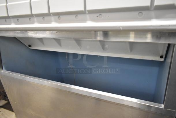 Hoshizaki stainless steel commercial ice head on bin. Durable construction. Good condition. Ideal for high-demand settings.