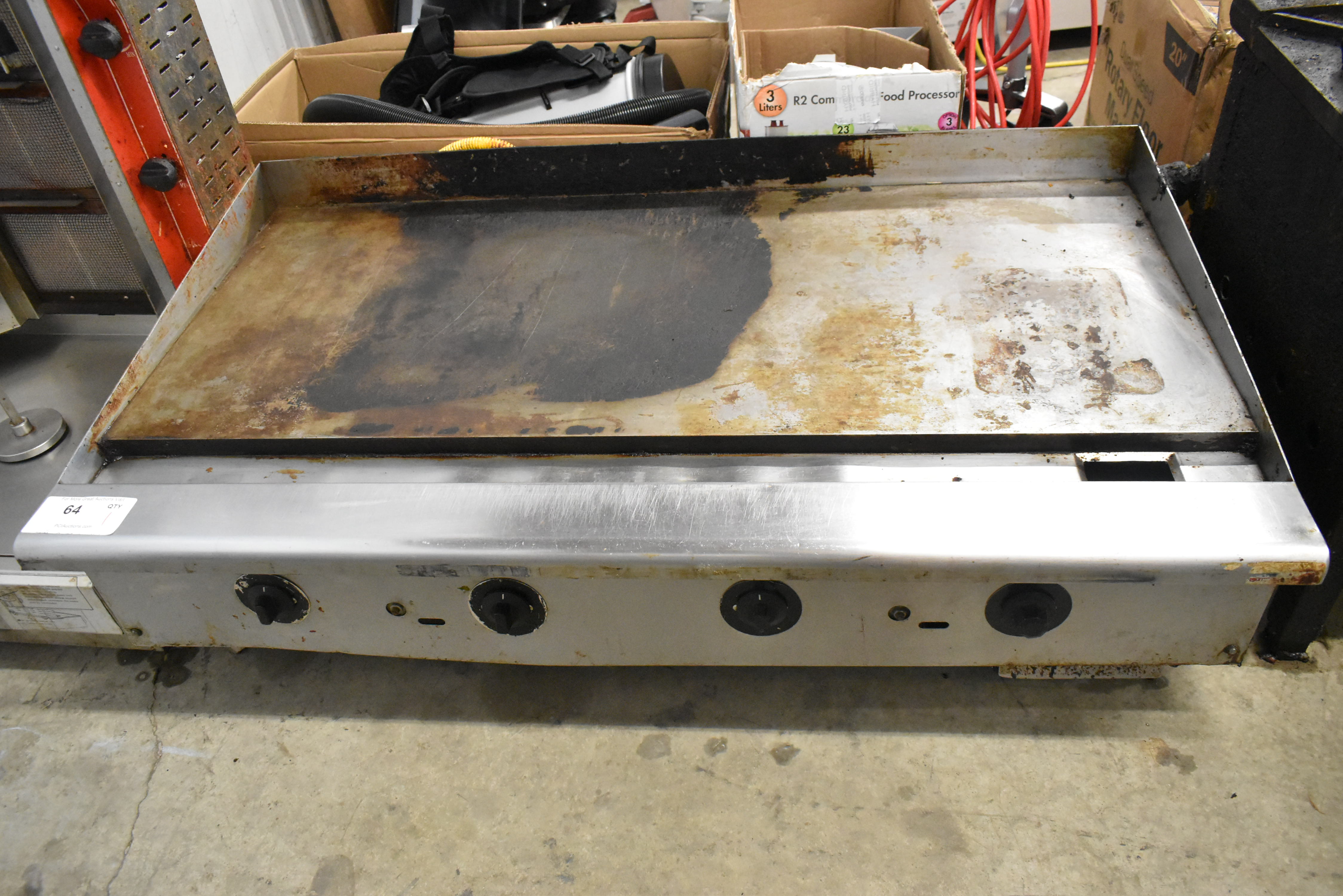 Warped griddle surface