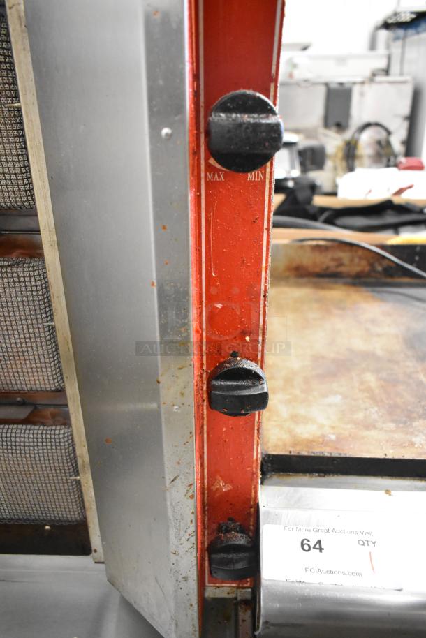 Cookline 3G stainless steel gyro broiler, side view showing control knobs for heat adjustment; used condition.