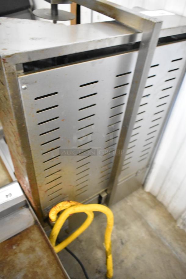 Cookline 3G stainless steel vertical gyro shawarma broiler, 55 lb capacity, 39,000 BTU. Signs of use on exterior.