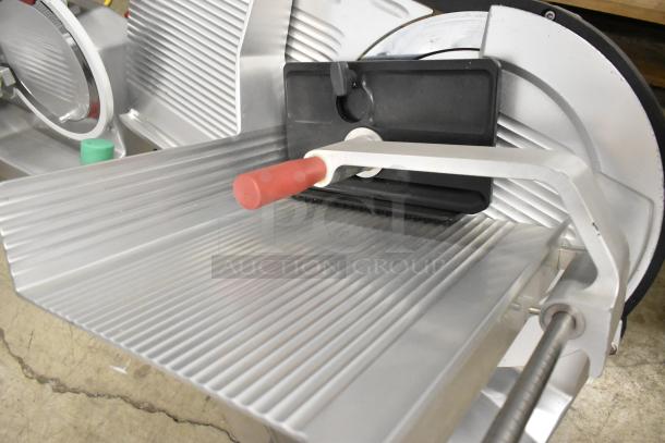 2023 Bizerba GSP H metal commercial meat slicer, countertop model, 120V, 1 phase, excellent condition, red handle.