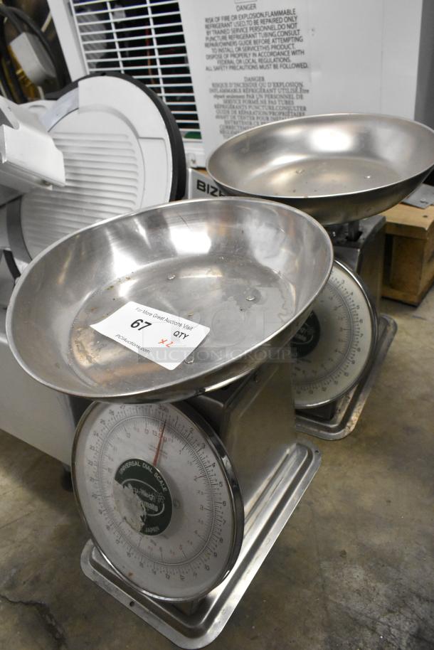 Two Universal AccuWeigh Yamaha SM(N) countertop scales, 30 lb capacity, metal construction, visible dial, label indicating auction details.