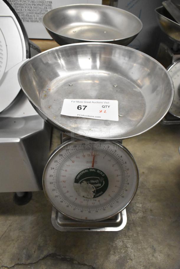 Two Universal AccuWeigh Yamaha SM(N) countertop scales, 30 lb capacity each. Visible wear, clear dial reading. Auction tag states "67 QTY x 2".
