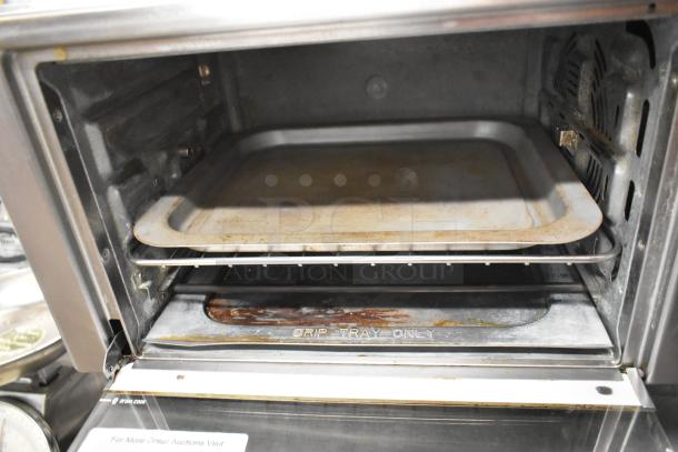 Metal countertop electric toaster oven with tray, 120 volts, 1 phase, used condition, "Drip Tray Only" marking inside.