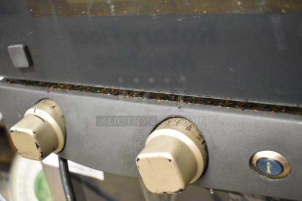 Cadco Unox Roberta XAF003 convection oven, stainless steel, 120V, visible wear on control knobs, countertop model.
