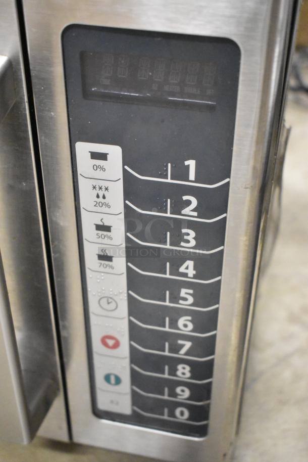 2016 Amana RCS10TS stainless steel commercial microwave oven, 120 volts, keypad controls, visible wear.