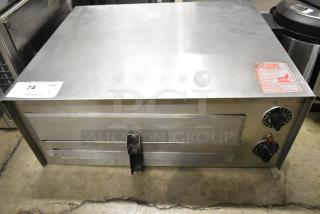 Wisco 560 stainless steel countertop pizza oven, electric 120V, 1 phase. Used condition, with control knobs and caution label.