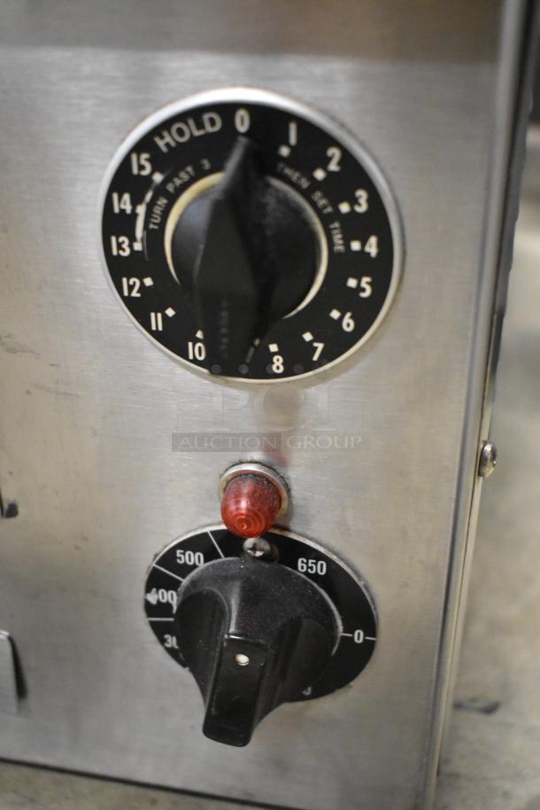 Wisco 560 stainless steel countertop pizza oven controls, showing temperature and timer dials, in good condition. 120V, 1 phase.
