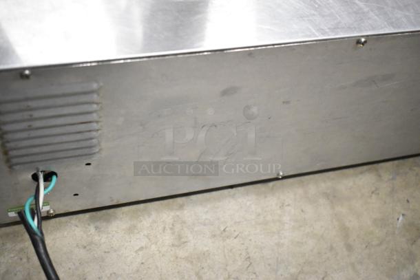 Wisco 560 stainless steel countertop pizza oven, electric powered, 120 volts, 1 phase, visible wiring, used condition.