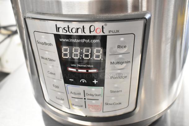 Instant Pot Lux 80 countertop pressure cooker, IP-LUX model, featuring various cooking settings; in good condition.