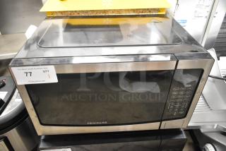 Frigidaire EMW1120-B-3ACOM stainless steel countertop microwave, 120 volts, 1 phase, includes plate, visible controls.