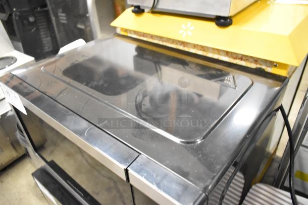Frigidaire EMW1120-B-3ACOM stainless steel countertop microwave oven with visible top plate, 120 volts, 1 phase, gently used.