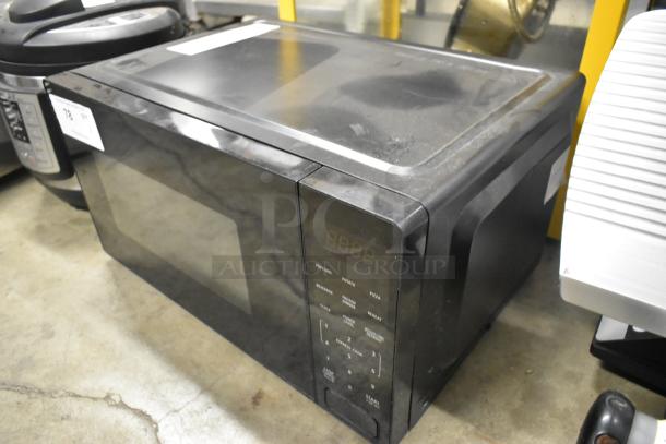 Walmart MS54100112162 countertop microwave oven with plate, black, 120V, 1 phase, visible control panel, used condition.